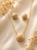 Pearl mica cremation memorial orb jewelry set with round pendant necklace and matching stud earrings in warm beige resin with gold hardware