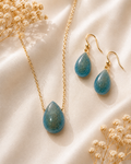 Ocean blue teardrop resin memorial necklace and drop earring set with gold-tone hardware and cremated remains